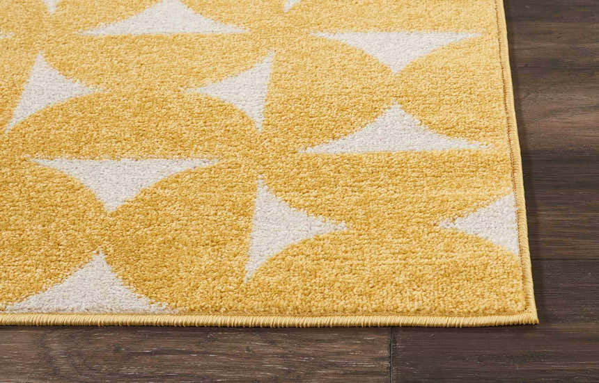 Close up of the Nourison Harper Yellow rug showing its geometric pattern and textured weave.