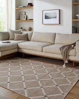 Living room scene with beige sectional and Alpana Washable Wool Area Rug in beige, ivory, and slate gray with a geometric pattern. Roomscene-Rectangle
