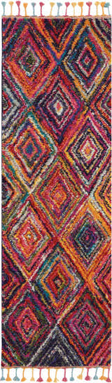 Close-up of Nourison Nomad Red Multicolor Tribal rug with diamond pattern and colorful tassels.