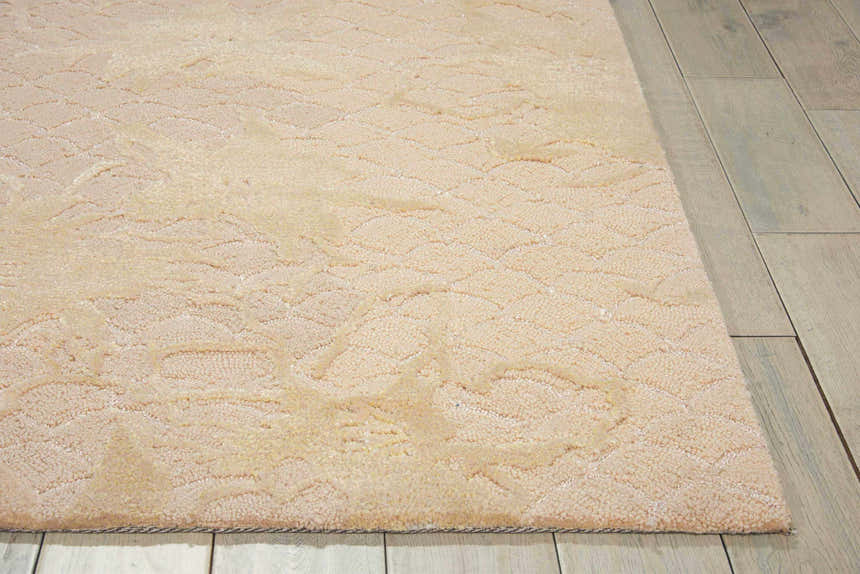 Close up of the Nourison Escalade Sand Area Rug showing its subtle geometric pattern and soft, textured pile.