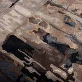 Close-up of the Rizzy KIN533 area rug. Abstract design in beige, charcoal, dark brown, ivory and gray. Hand-tufted wool blend. Texture