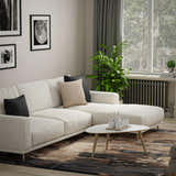 Living room with a beige sectional sofa and Rizzy KIN533 beige, brown, and charcoal contemporary area rug. Roomscene-Rectangle