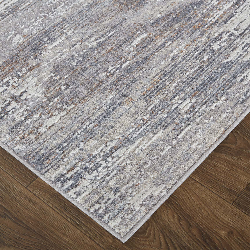 Close up of the Feizy Lennon Taupe/Tan/Orange Area Rug showing abstract pattern and texture. Corner