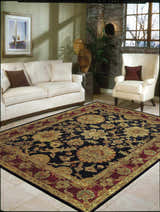 Living room with ivory sofa and Nourison Jaipur Black Persian rug.