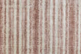 Close-up of Feizy Mackay rug showing tan, ivory, and pink stripes with a soft, hand-woven texture. Texture