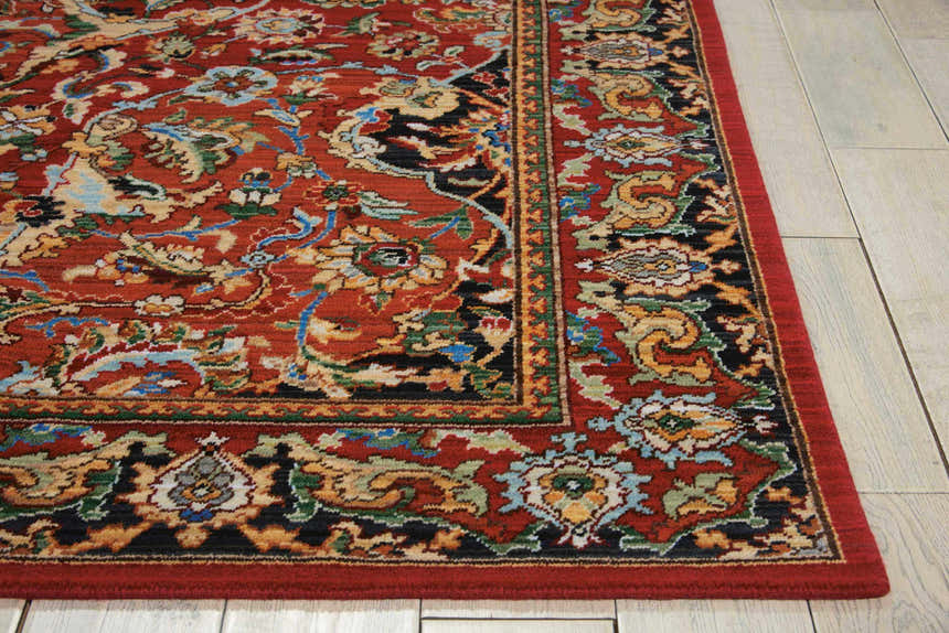 Close-up of the Nourison Timeless Red Traditional Indoor Area Rug, showcasing its floral pattern and wool texture.