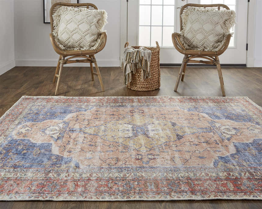 Entryway with Feizy Percy rug in red, tan, and blue, wicker chairs, and a woven basket. Roomscene-Rectangle