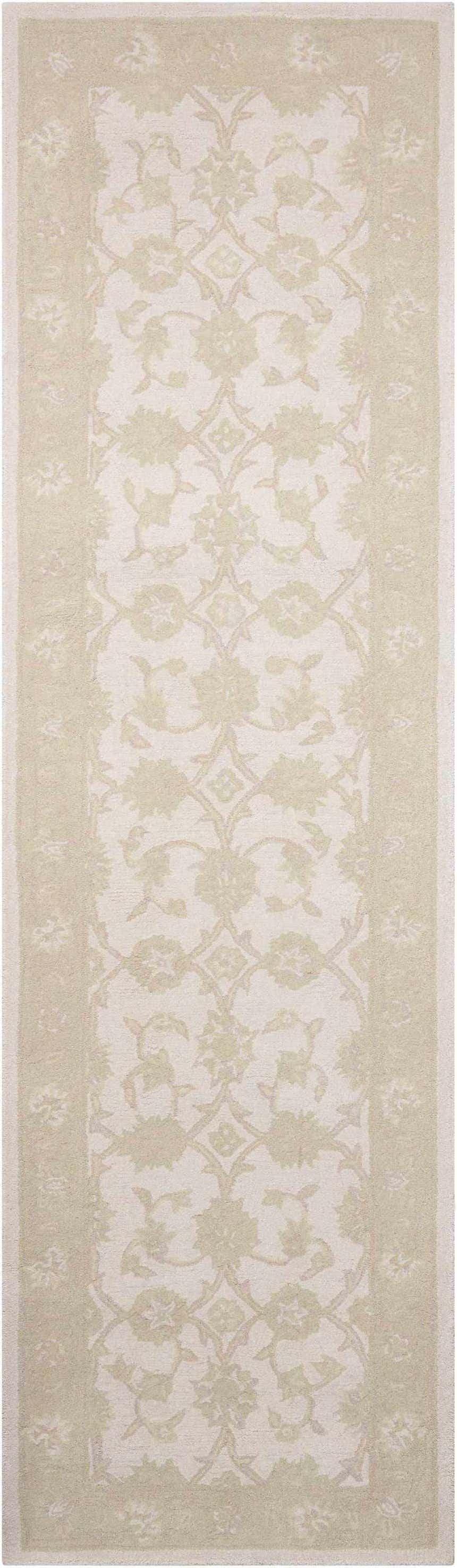 Close-up of Nourison Zephyr Ivory/Green rug. Handmade wool runner with chestnut floral pattern and border.