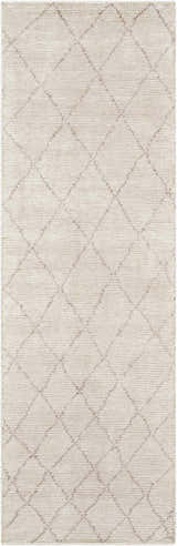 Close-up of the Calvin Klein Home Heath Tusk rug. Handmade rayon rug with a subtle diamond pattern in tusk color.