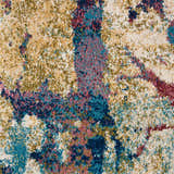 Close-up of Nourison Fusion Cream Multicolor rug. Abstract pattern in cream, teal, pink, gold, and navy. Soft, textured pile.