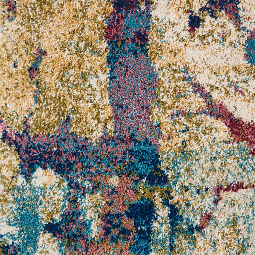Close-up of Nourison Fusion Cream Multicolor rug. Abstract pattern in cream, teal, pink, gold, and navy. Soft, textured pile.
