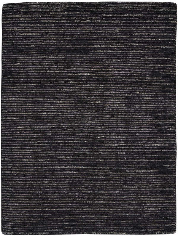Close-up of the Nourison OCEAN Onyx rug. Black rug with a subtle horizontal stripe pattern and textured, handmade construction.