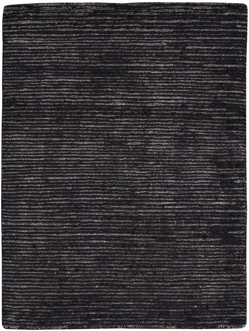 Close-up of the Nourison OCEAN Onyx rug. Black rug with a subtle horizontal stripe pattern and textured, handmade construction.
