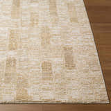 Close-up of the light gray and tan Kapueo Area Rug showing the subtle geometric pattern and soft texture. Front
