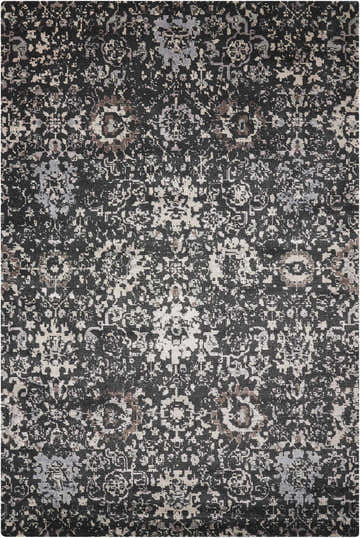 Close-up of the Nourison Twilight Onyx Persian rug. Black rug with distressed, intricate patterns in gray, beige, and brown tones.
