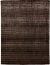 Close-up of the Nourison Aura Chocolate rug. Brown, horizontal stripes create a modern, textured pattern.