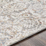 Close up of the Marden Textured Luxe Area Rug showing cream, gray, tan, and blue tones. Texture