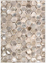Close-up of Michael Amini City Chic Silver area rug featuring a geometric hexagon pattern in silver, gray, and tan tones.