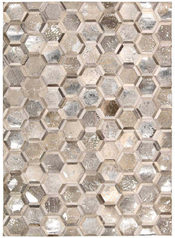Close-up of Michael Amini City Chic Silver area rug featuring a geometric hexagon pattern in silver, gray, and tan tones.