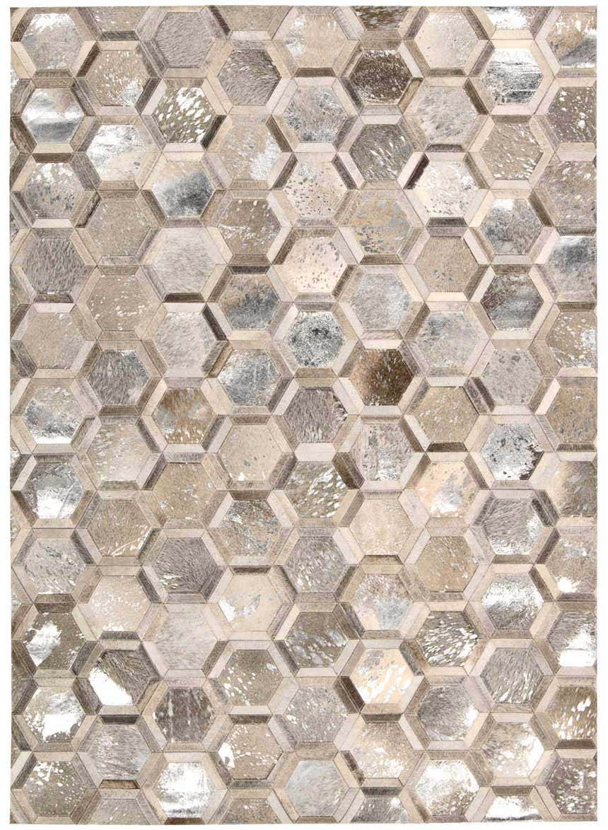 Close-up of Michael Amini City Chic Silver area rug featuring a geometric hexagon pattern in silver, gray, and tan tones.
