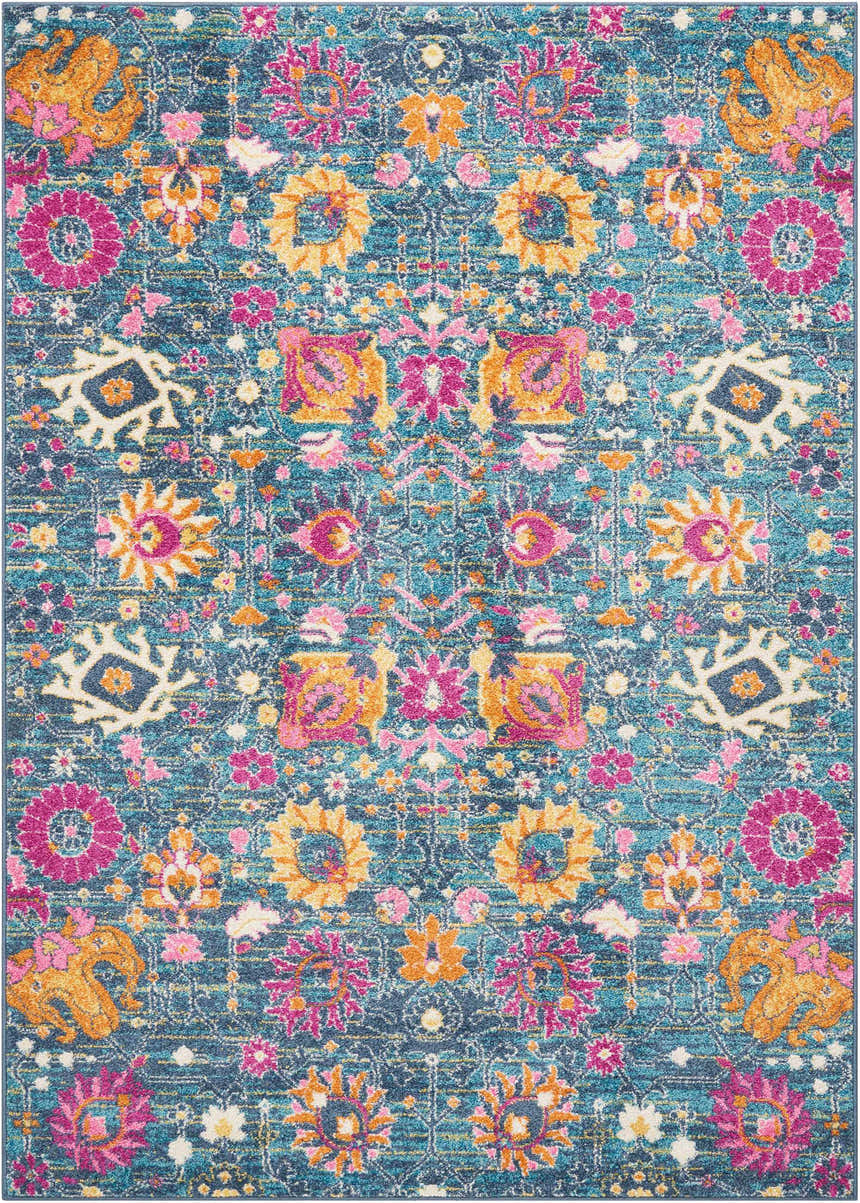 Close-up of Nourison Passion Denim rug. Bohemian style with floral pattern in denim blue, pink, and gold.