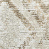 Close-up of the high pile Nourison Dekor Ivory Taupe rug. Machine-made with a modern ivory and taupe design.