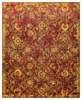 Close-up of Nourison Timeless Pomegranate Persian rug. Features a detailed floral pattern in pomegranate red, gold, and green.