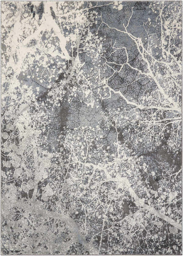 Close-up of the Nourison Maxell Grey area rug, featuring a modern abstract tree branch design in shades of gray and white.