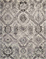 Close-up of the Nourison Twilight Ivory Grey Vintage Area Rug, featuring a distressed chestnut pattern and soft texture.