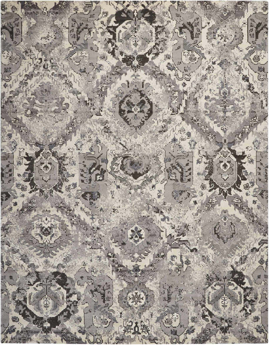 Close-up of the Nourison Twilight Ivory Grey Vintage Area Rug, featuring a distressed chestnut pattern and soft texture.