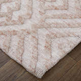 Close-up of the Feizy Colton Modern Diamond Pink/Ivory Area Rug showing the diamond pattern and plush texture. Corner