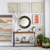 Living room scene with a Flintville Moroccan Shag Area Rug in light beige and charcoal, styled with a console table and wall art. Styleshot