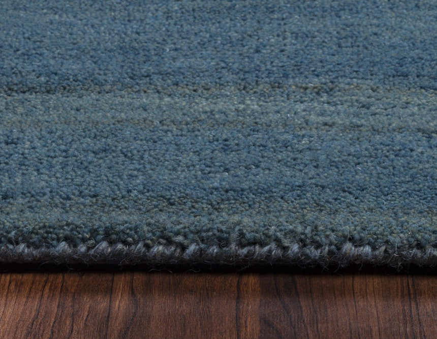 Close-up of the hand-tufted Rizzy MV3161 area rug. Features a hard-twist wool texture and blue farmhouse style. Pile