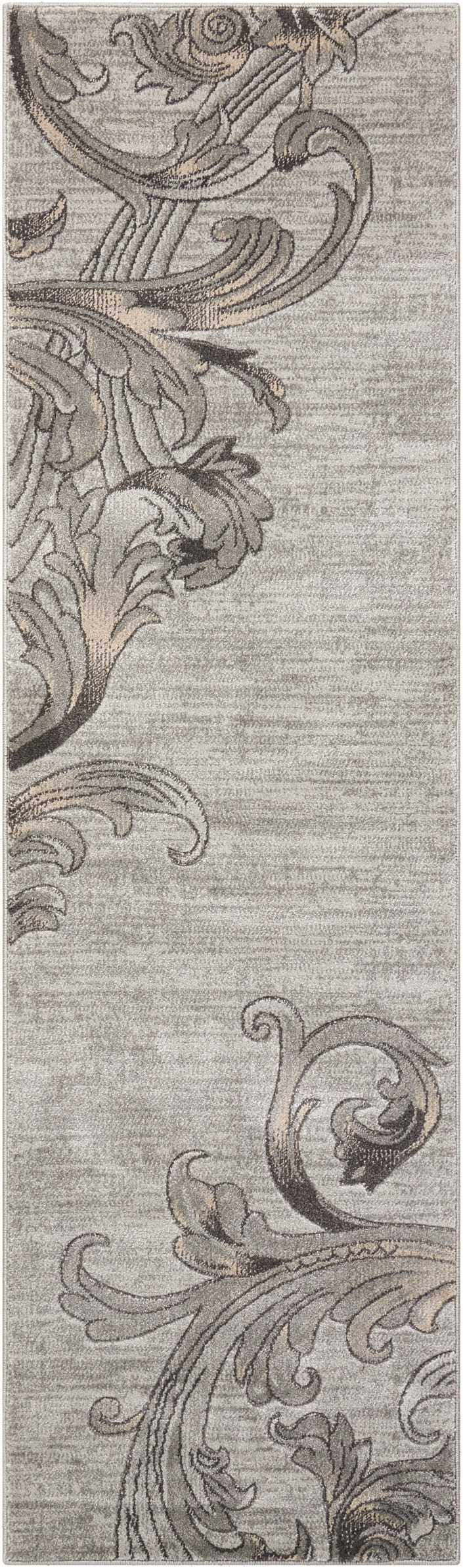 Close-up of Nourison Maxell Graphite rug. Contemporary style with a swirling floral pattern in shades of gray and beige.