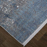 Close-up of Feizy Cadiz Modern Abstract rug in blue, gray, and silver. Contemporary design with textured pattern. Corner