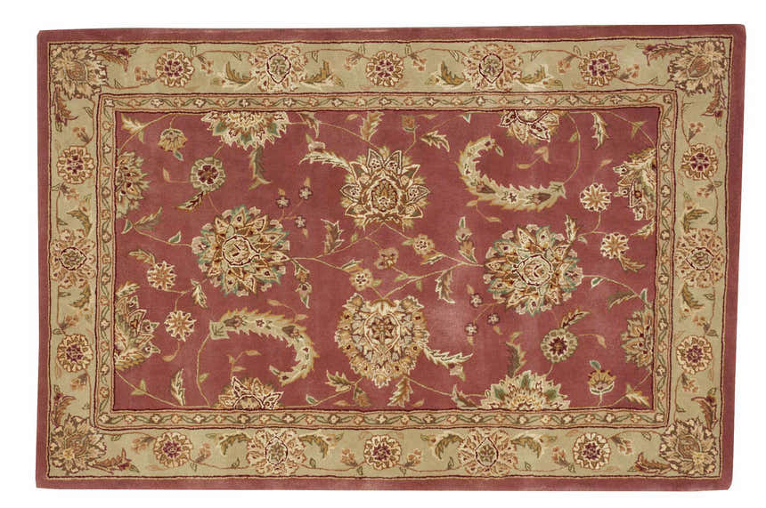 Close-up of the Nourison 2000 Rose Persian rug. Pink wool rug with a floral Persian design and sage green border.