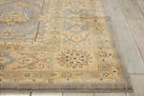 Close-up of the slate Nourison Persian Empire rug. Persian style rug in taupe with floral pattern and border detail.