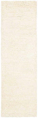 Close-up of the plush, snow white Nourison Fantasia shag rug. Handmade wool runner with a thick, textured pile.