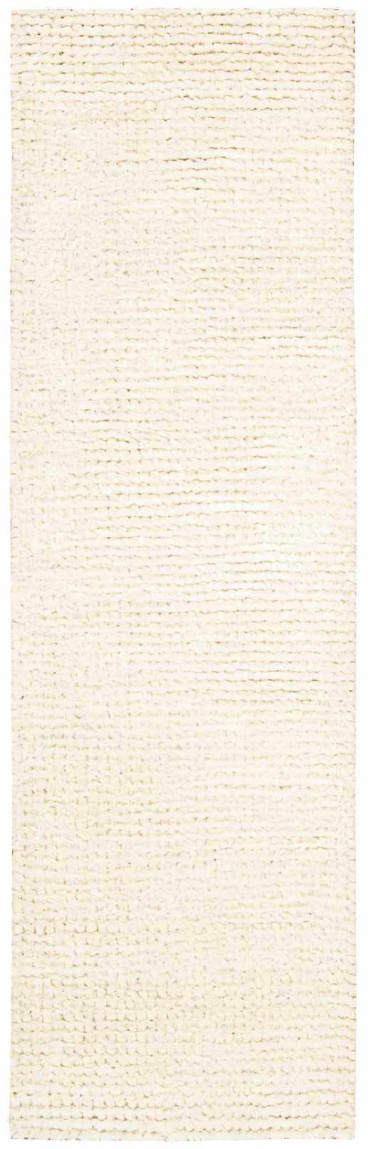 Close-up of the plush, snow white Nourison Fantasia shag rug. Handmade wool runner with a thick, textured pile.