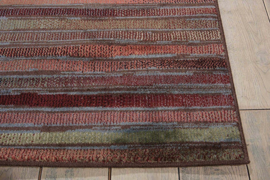 Close-up of the multicolor, painterly striped design of the Nourison Expressions area rug.