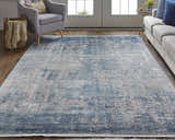 Living room scene with blue sofa, gray chair, and Feizy Cadiz Blue/Gray abstract area rug. Roomscene-Rectangle