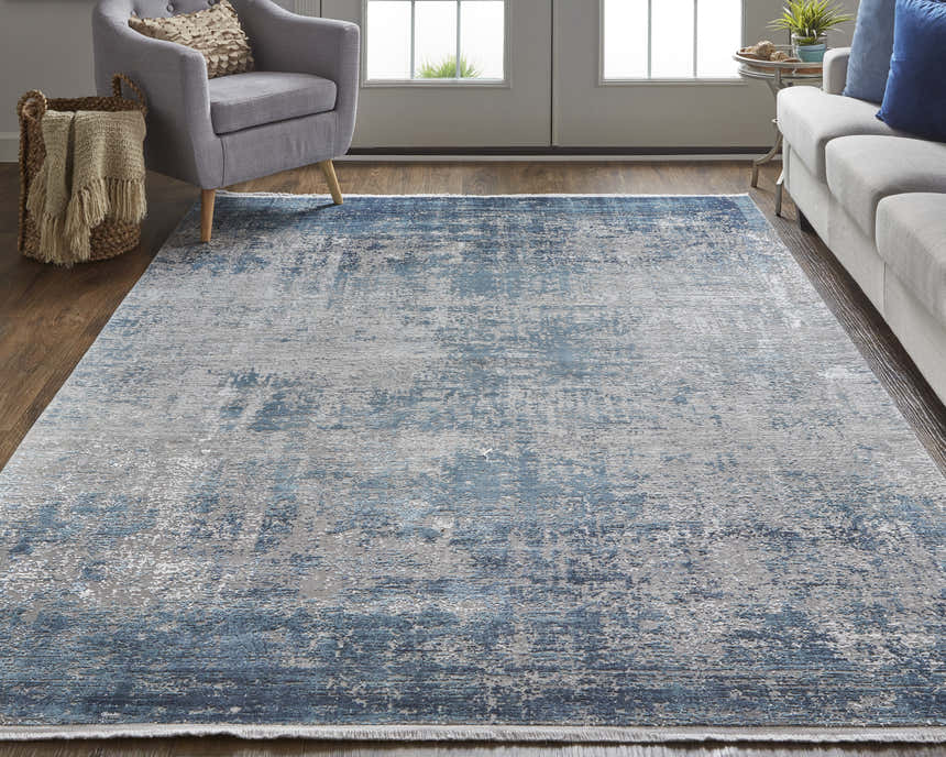 Living room scene with blue sofa, gray chair, and Feizy Cadiz Blue/Gray abstract area rug. Roomscene-Rectangle