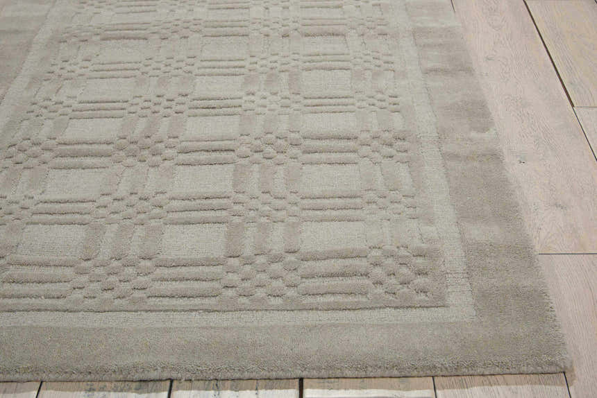 Close-up of the textured, geometric pattern on the grey Nourison Westport wool area rug.