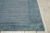 Close-up of the handmade Barclay Butera Ripple Spa runner rug showing wool texture and spa blue color.