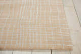 Close up of the Nourison Nepal Manilla Vintage Indoor Area Rug showing its grid pattern and soft manilla color.