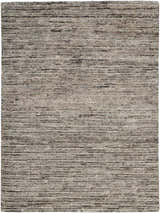 Close-up of the handmade Nourison OCEAN Sand area rug. Sandstone color with a subtle horizontal pattern and textured weave.
