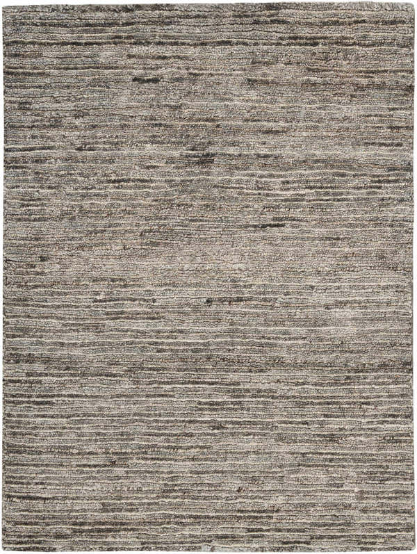 Close-up of the handmade Nourison OCEAN Sand area rug. Sandstone color with a subtle horizontal pattern and textured weave.