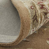 Close-up of the hand-tufted Feizy Prescott Tan/Ivory Area Rug showing floral details, texture, and backing. Fold