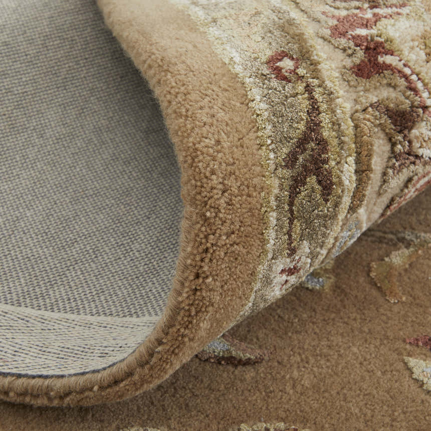 Close-up of the hand-tufted Feizy Prescott Tan/Ivory Area Rug showing floral details, texture, and backing. Fold