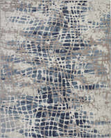 Close-up of Nourison Urban Decor Ivory/Grey rug. Abstract pattern in ivory, grey, and blue. Mid-Century Modern style.